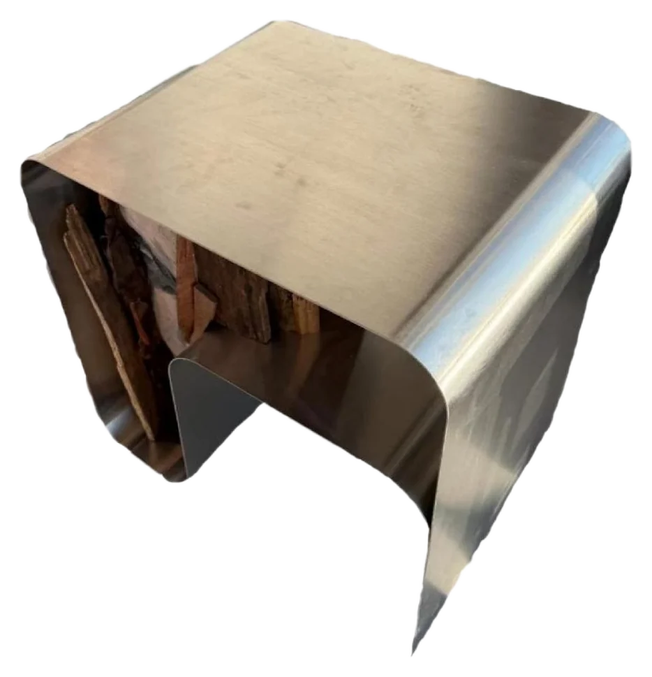 Steel coffee table with carved face and wood inside