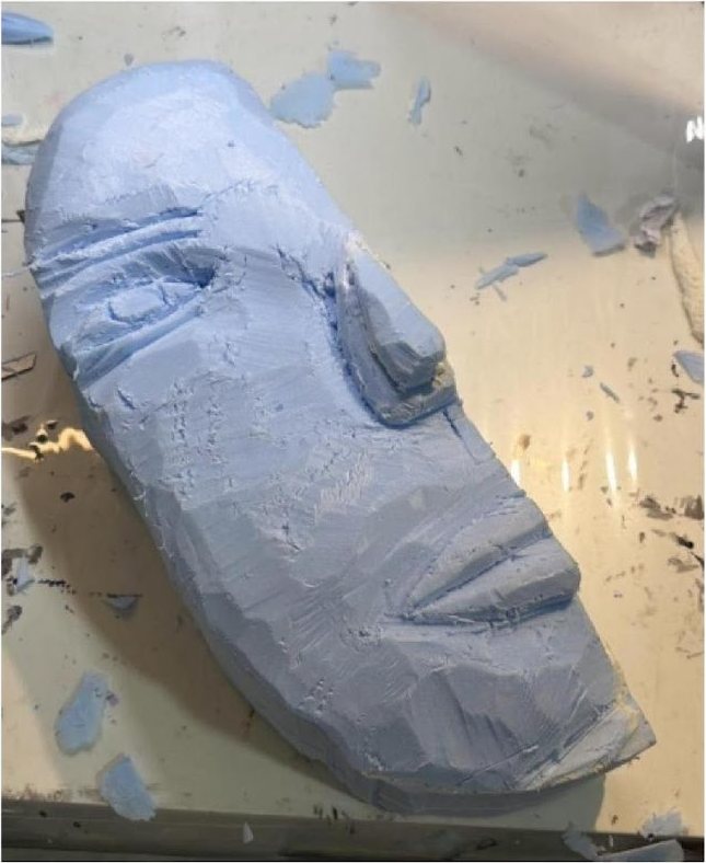 Face carved from blue foam